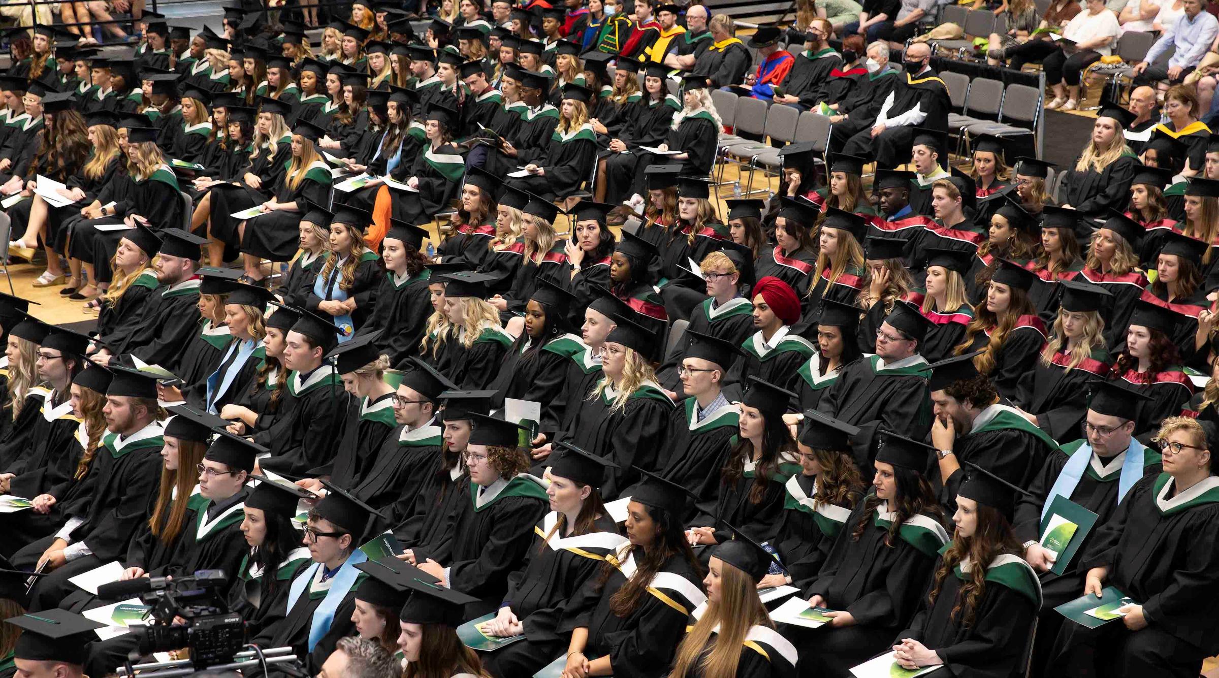 Graduating class sitting in the gymnasium