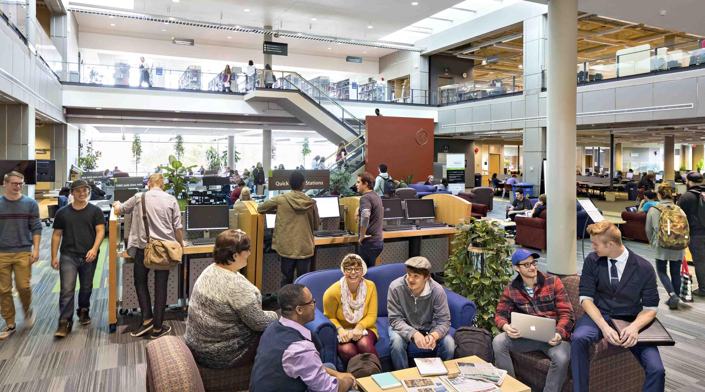 Happy students in the library 