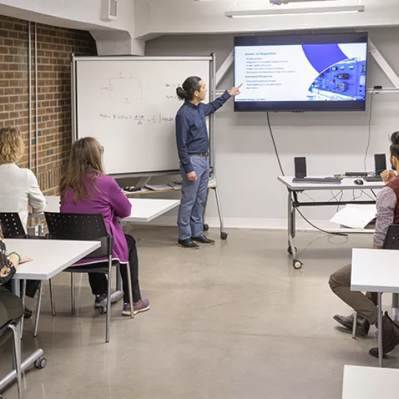 Instructor and students in Alternative Energy Lab