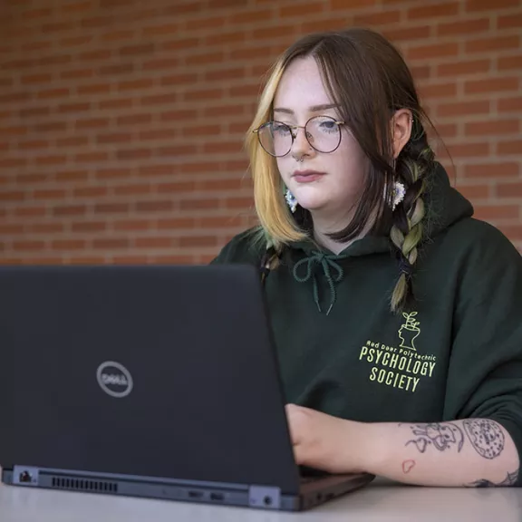 RDP Student Autumn working on laptop