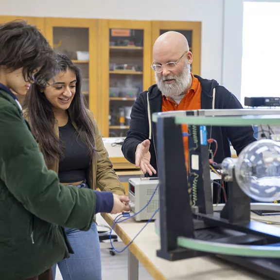 Physics Instructor with students