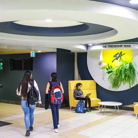 Students walking SA Friendship Nook