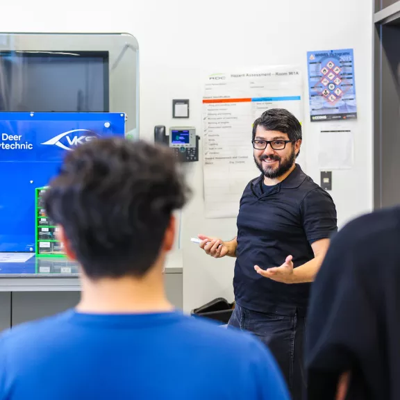 MET instructor in lab with students