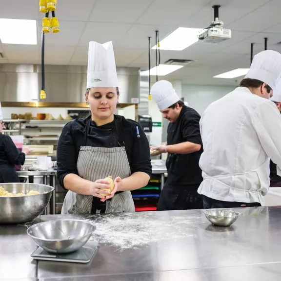 Cook students making pie crust