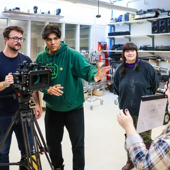 Film students setting up camera shot