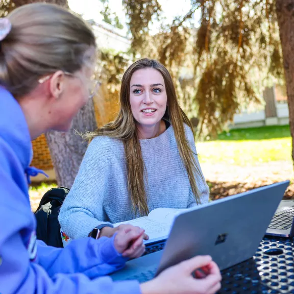 Instructor and student working outside