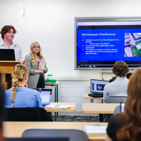 Justice Studies students doing presentation on movement predictors