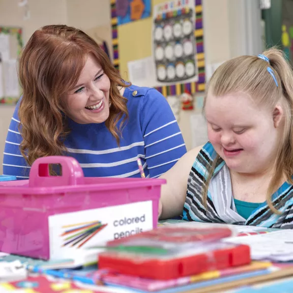 EA working with child who is colouring