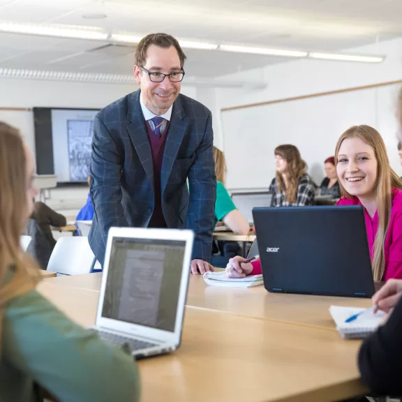 Humanities instructor with students in class