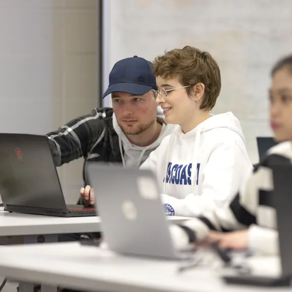 Students on laptop in classroom