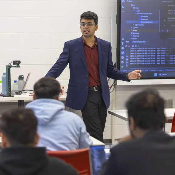 Computer Programming instructor in front of class