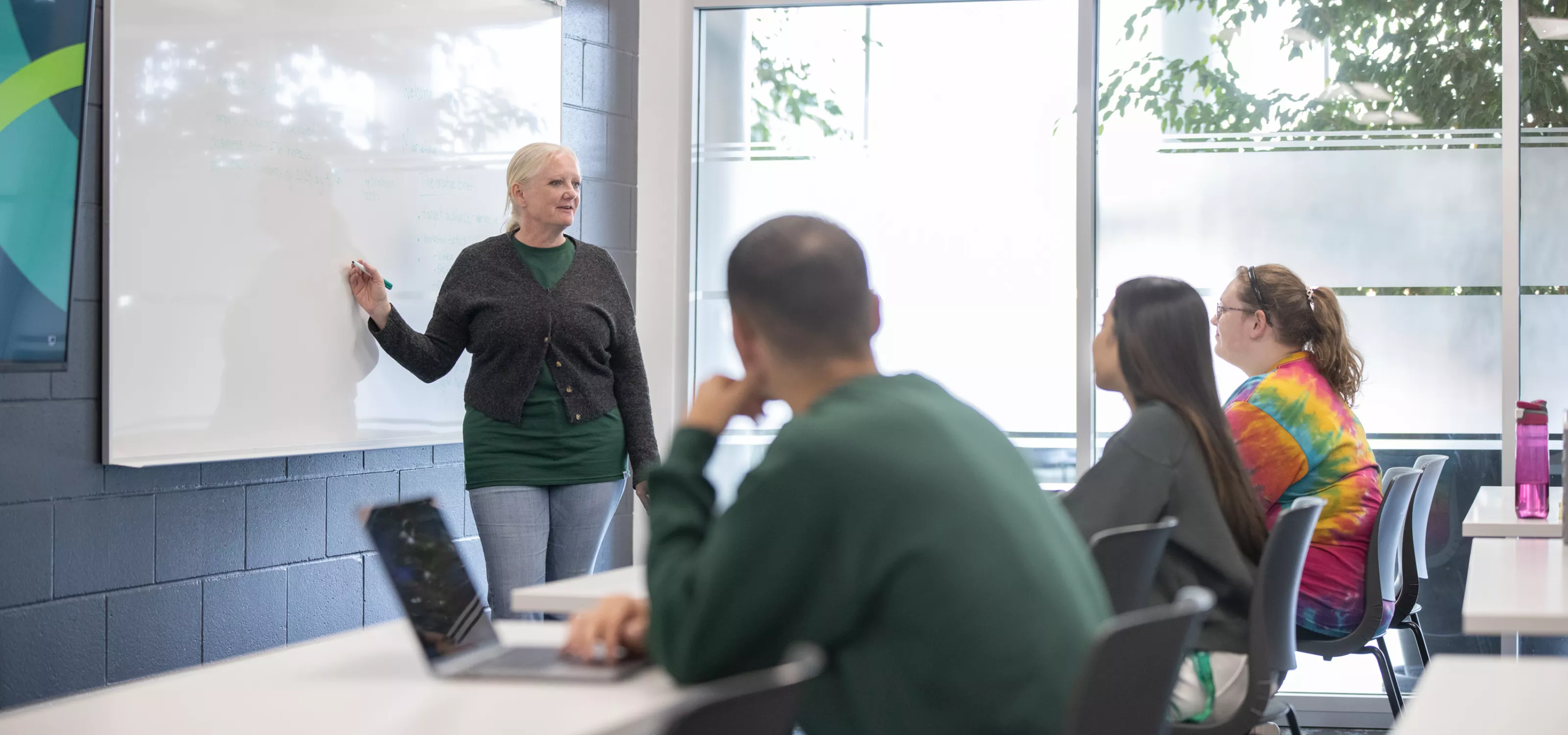 Instructor training students in a classroom.